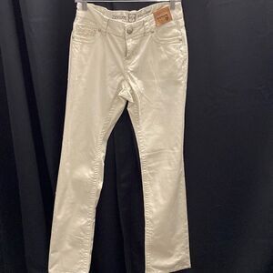 Cream colored bootcut jeans‎